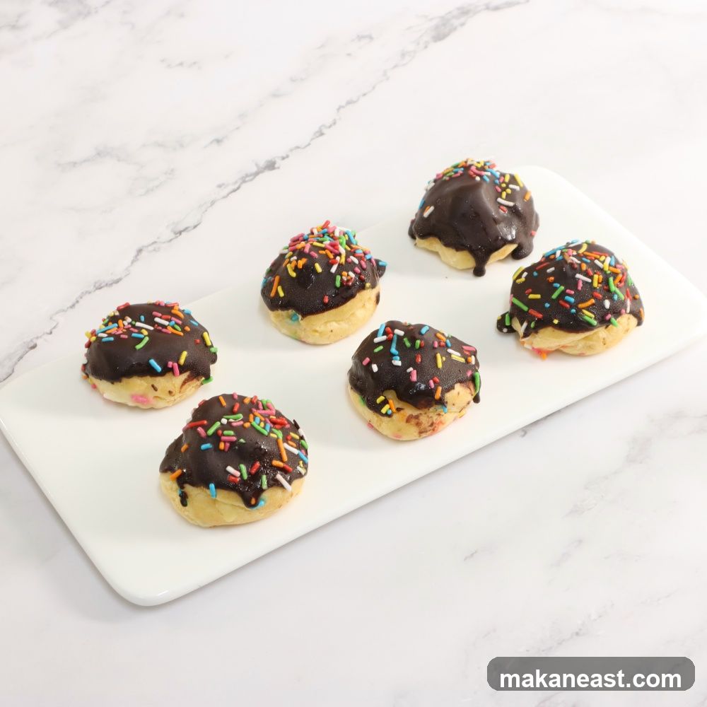 Chocolate Frosted Doughnuts with Sprinkles