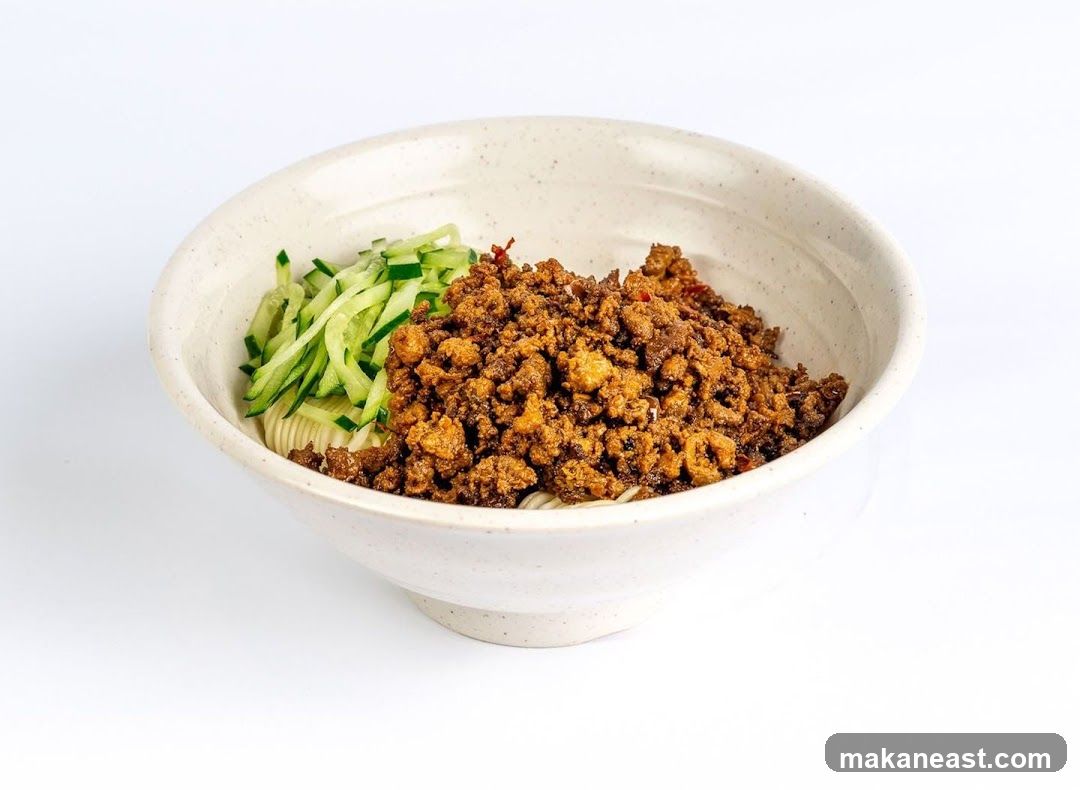 Bowl of Noodles with Minced Meat and Cucumber