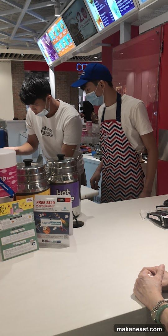 Staff preparing orders at a counter