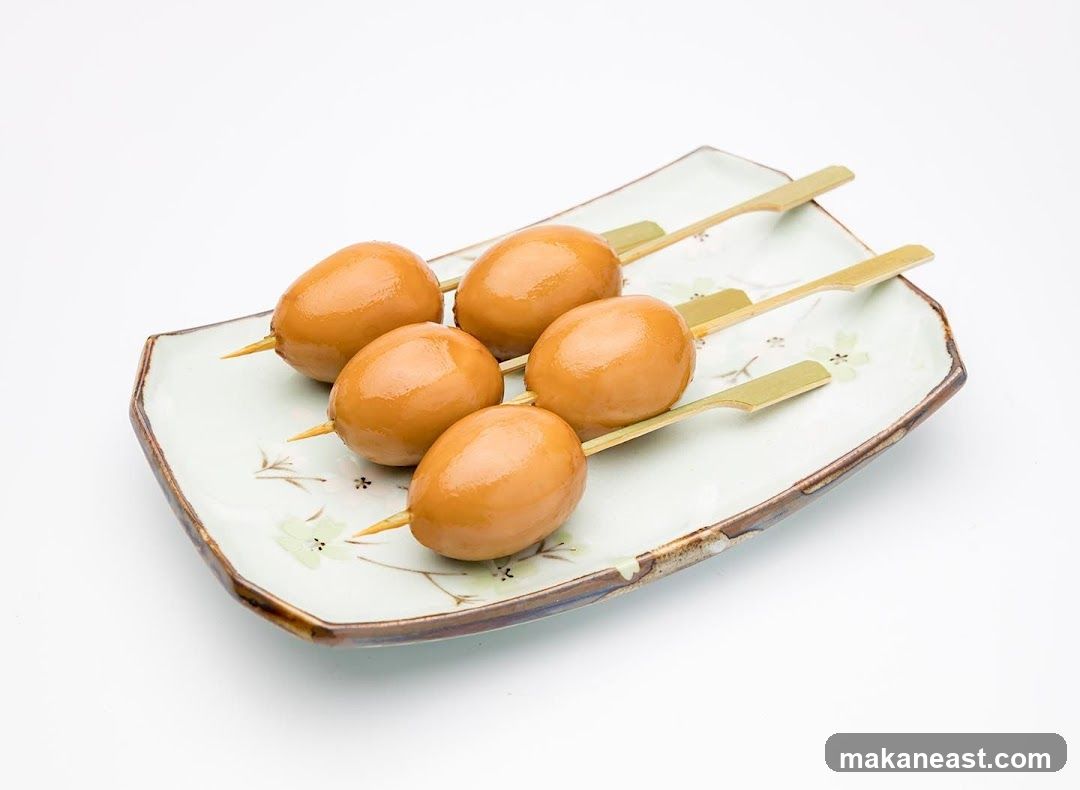 Five Skewered Braised Eggs on a Plate