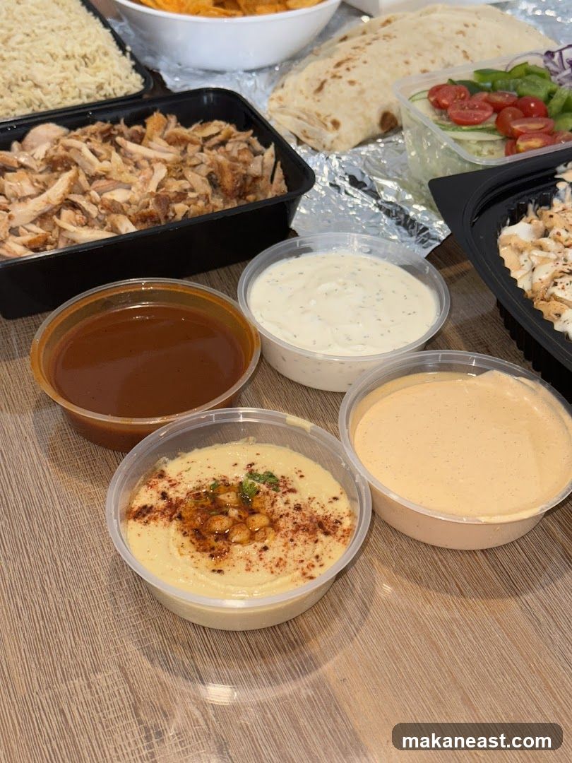 Takeaway Meal with Dips and Salad