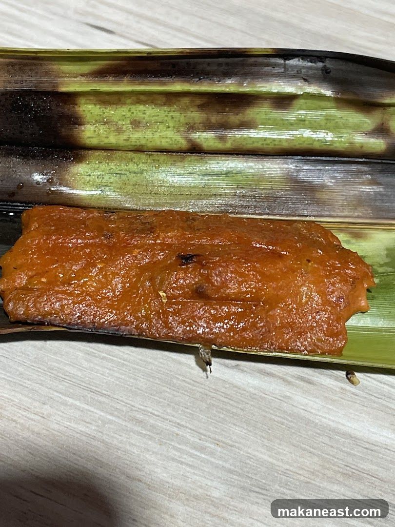 Food item wrapped in leaves