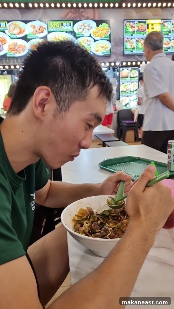Man Eating Noodles