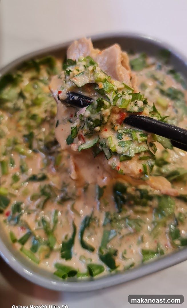 Close-up of a dish with meat and vegetables in a creamy sauce