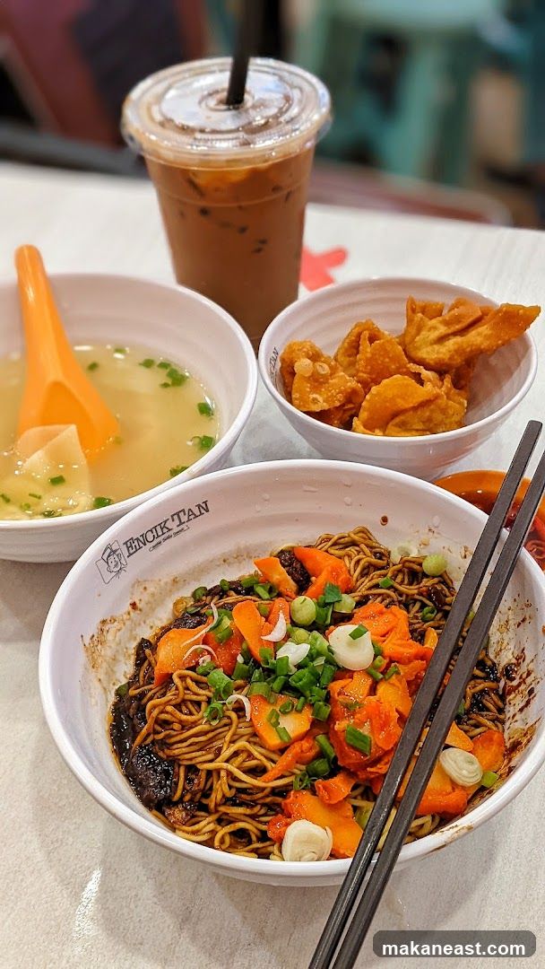 Noodles with toppings and a drink