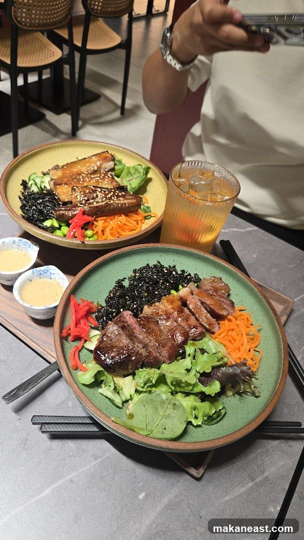 Two bowls of food with a drink