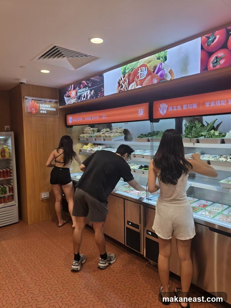 Diners selecting ingredients from a buffet