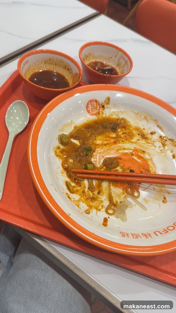Messy Plate with Chopsticks and Sauces