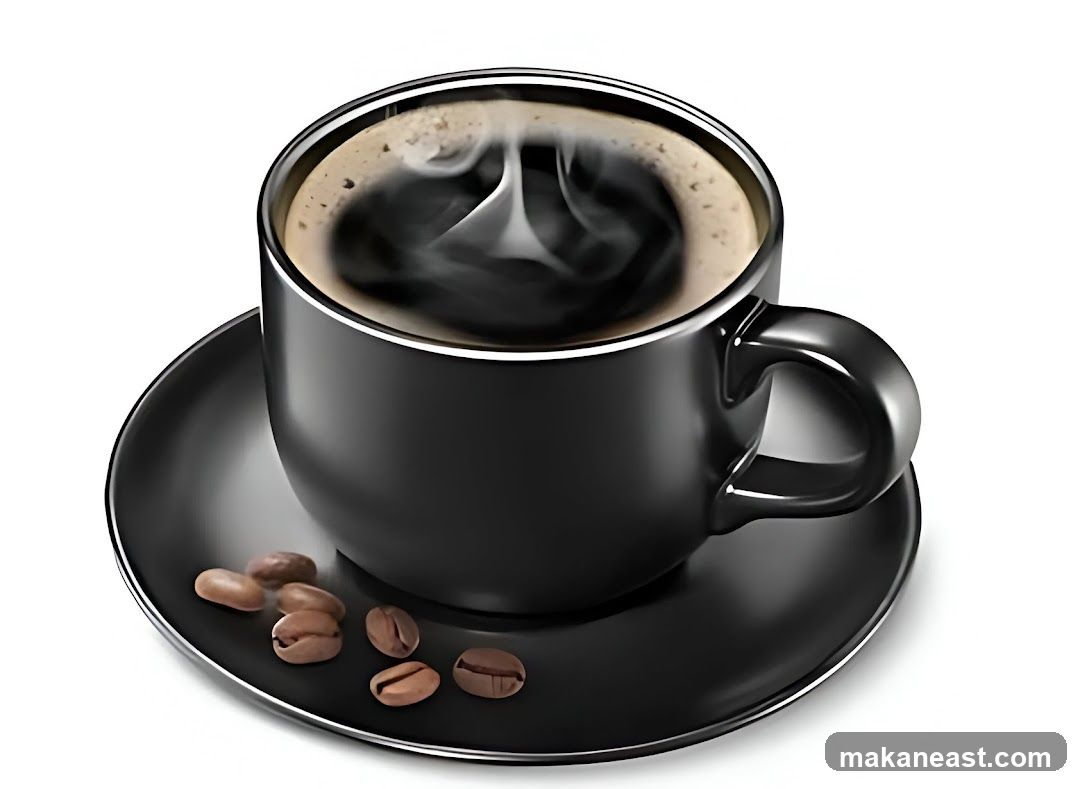 Black coffee with steam and beans