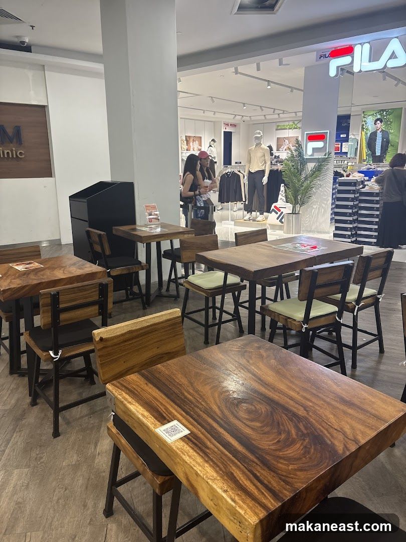 Cafe Seating Area with Retail Store in Background