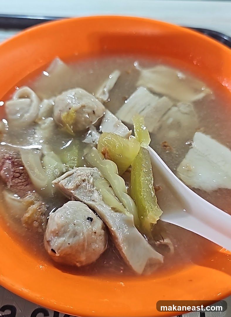 Bowl of Soup with Meatballs and Vegetables