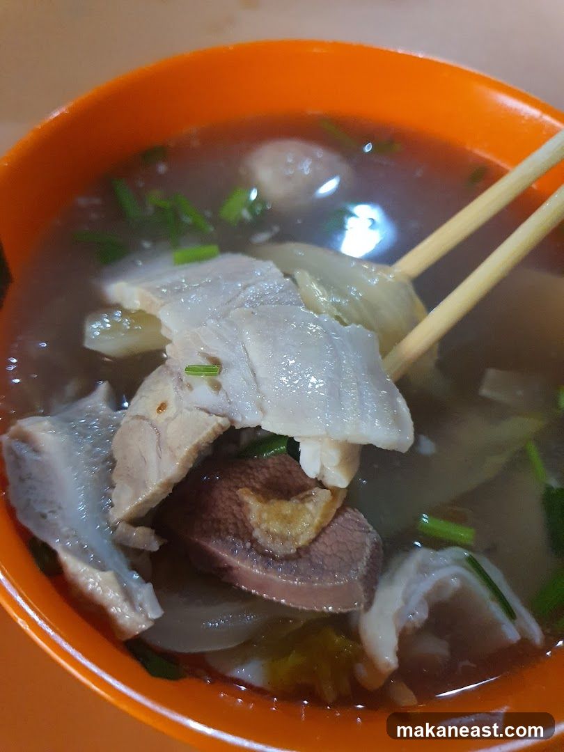 Bowl of Soup with Meat and Vegetables