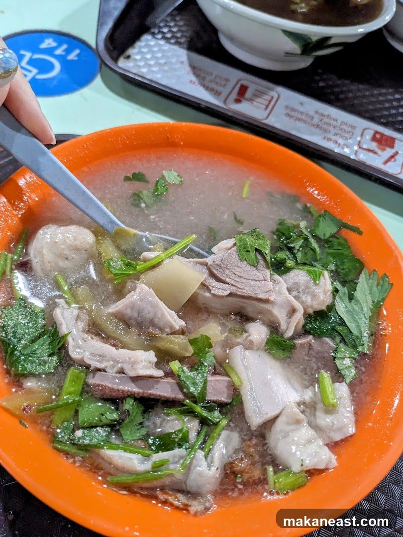 Bowl of Soup with Meat and Vegetables