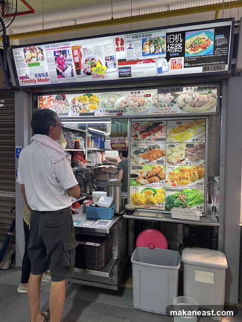 Food stall menu with newspaper clippings