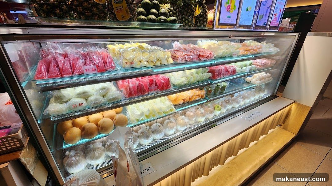Refrigerated Display Case with Fruits and Packaged Goods