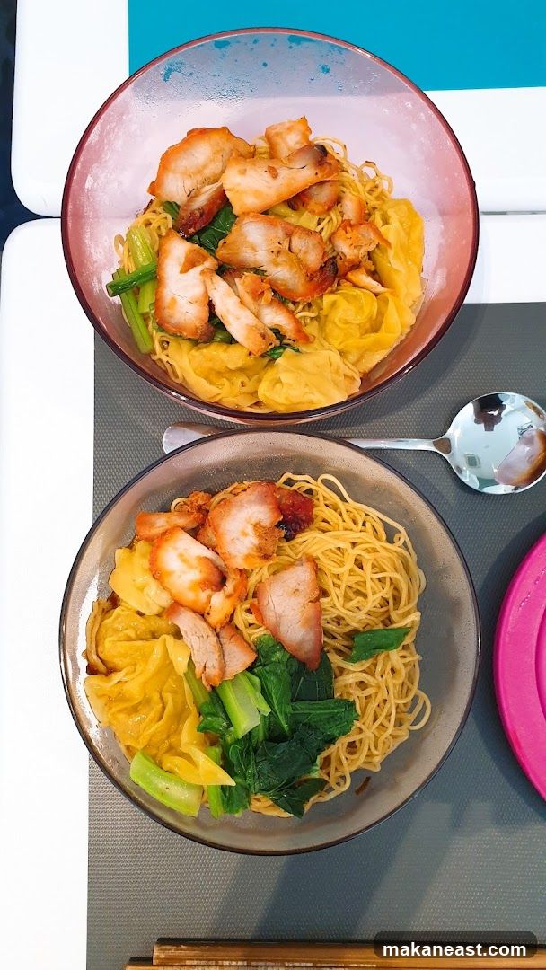 Two bowls of wonton noodles with char siu
