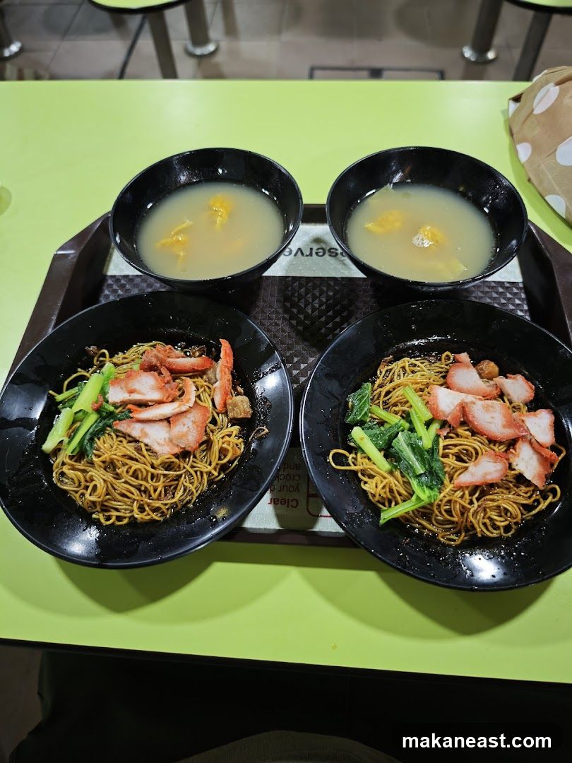 Two bowls of noodles with soup