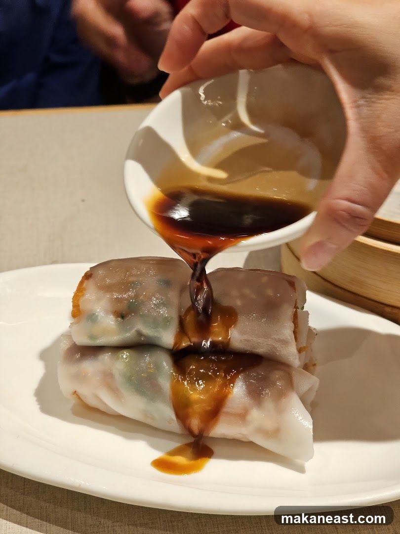 Pouring Sauce on Rice Noodle Rolls