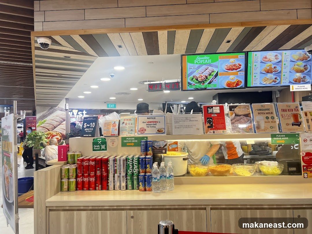 Food stall counter with menu displays and drinks