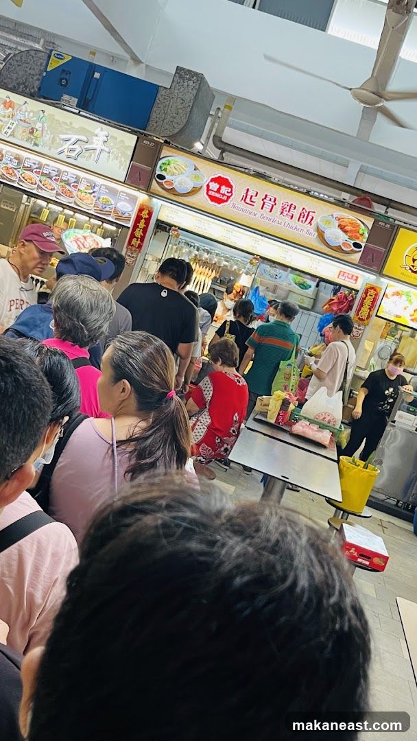 Busy Food Stall with a Queue