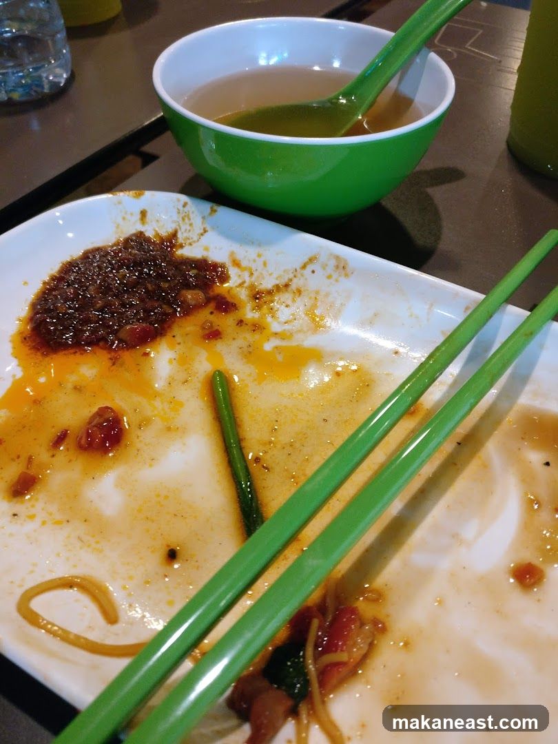 Messy Plate with Chopsticks and Soup Bowl