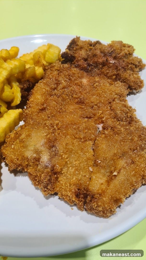 Breaded cutlet with fries