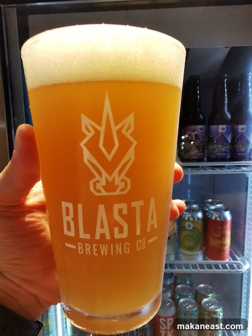 Beer in a glass with brewery logo
