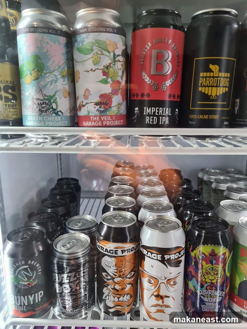 Cans of Beer in a Refrigerator