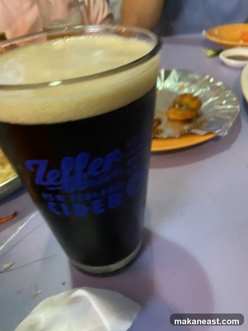 Glass of dark cider