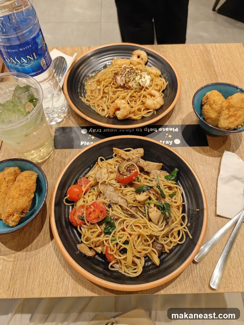 Two Pasta Dishes with Fried Chicken and Drinks