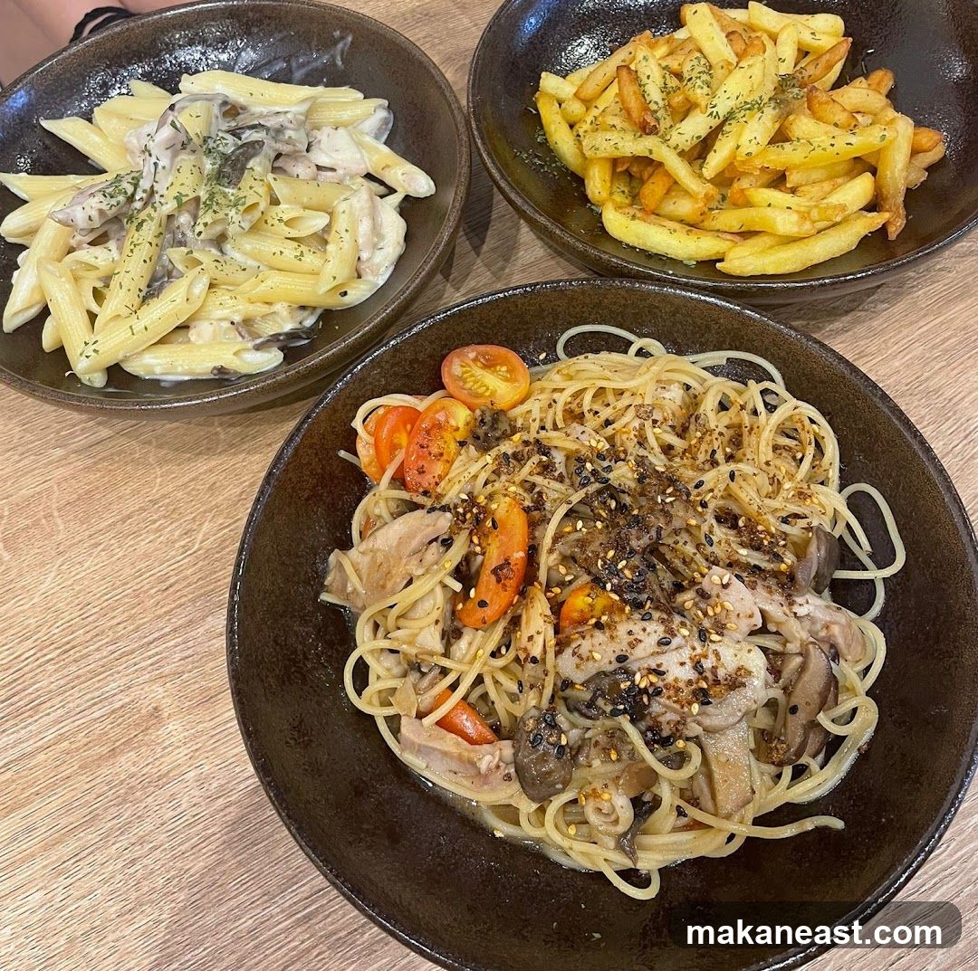 Three bowls of pasta and fries