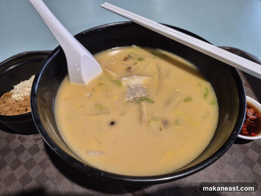 Bowl of Soup with Side Dishes