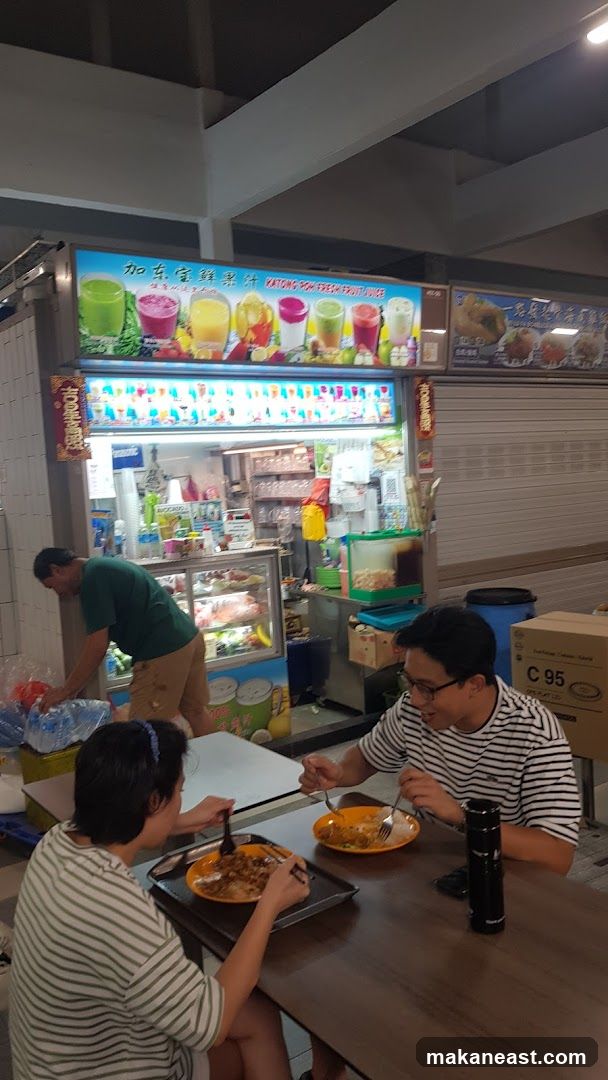 People eating at a food stall
