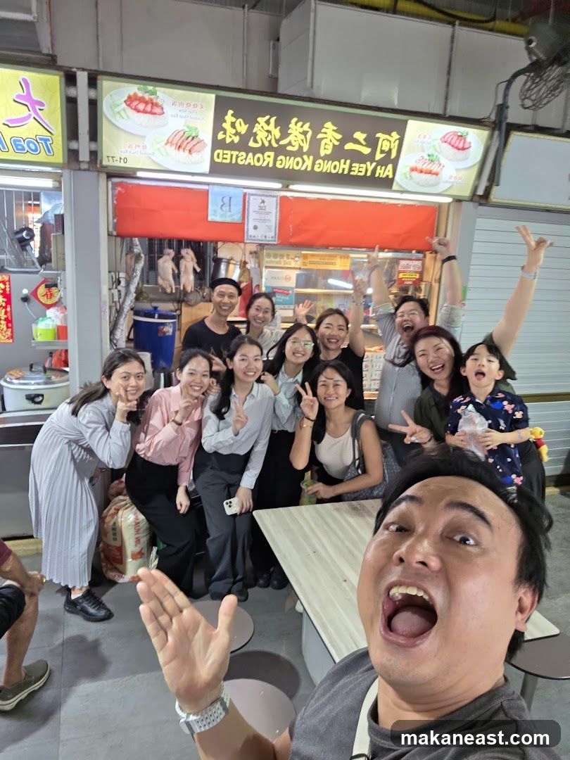 Group posing for a photo at a food stall