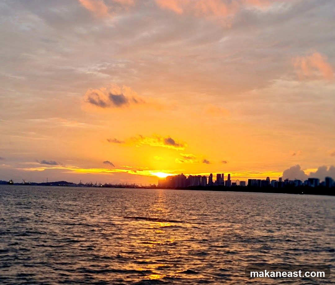 Sunset over the Ocean with City Skyline