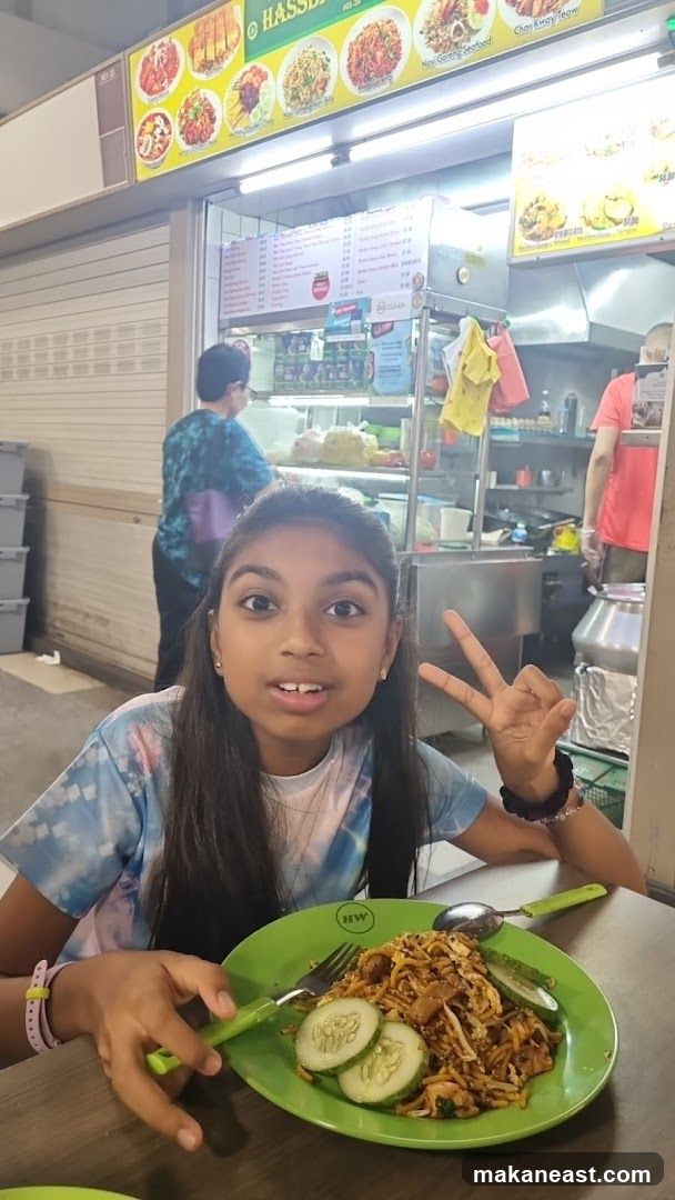 Girl with food at a hawker stall