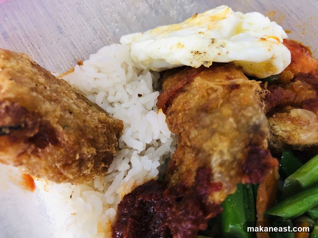 Rice dish with fried items and egg