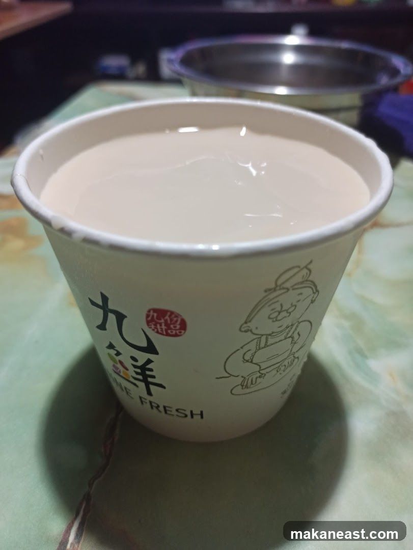 Beverage in a branded cup
