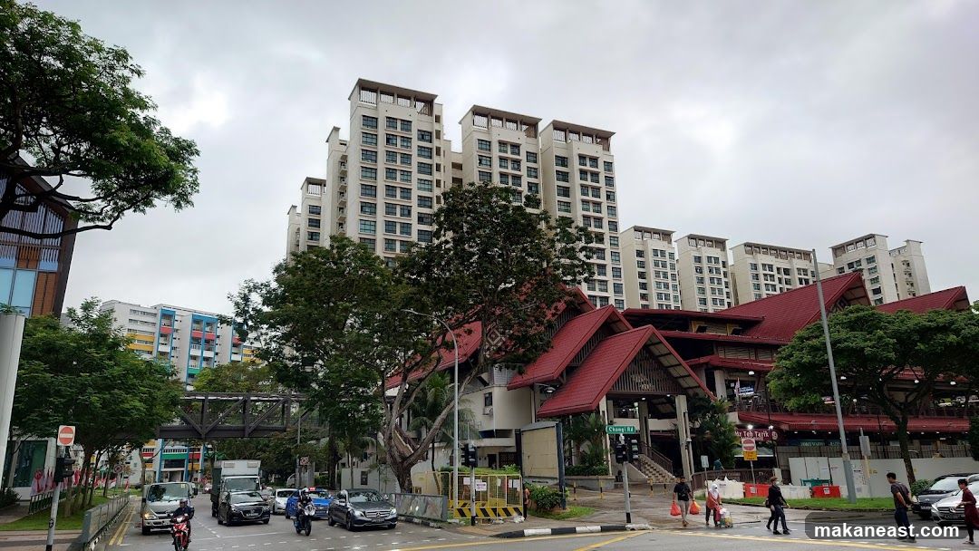 Street view with apartment buildings and a market
