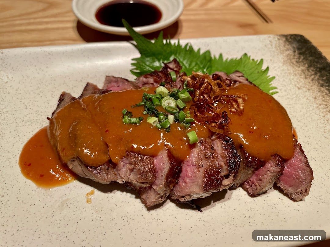 Sliced steak with sauce