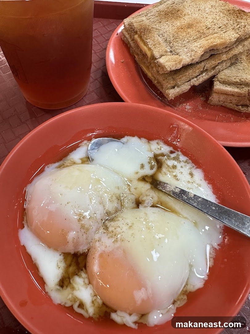 Soft-boiled eggs with toast and tea