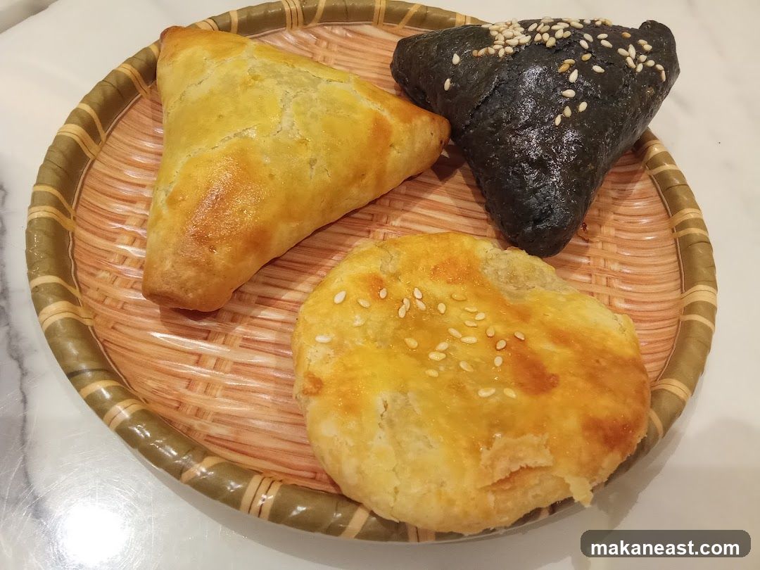 Three Pastries on a Wicker Tray