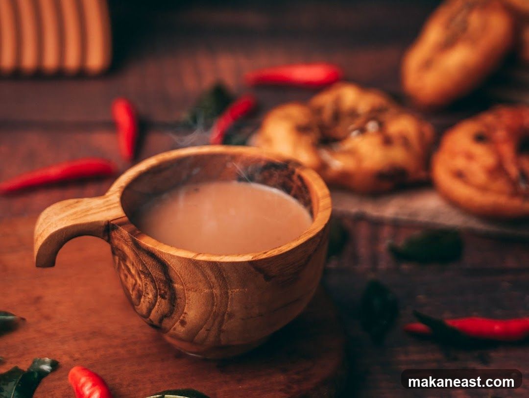 Steaming Beverage with Savory Snacks