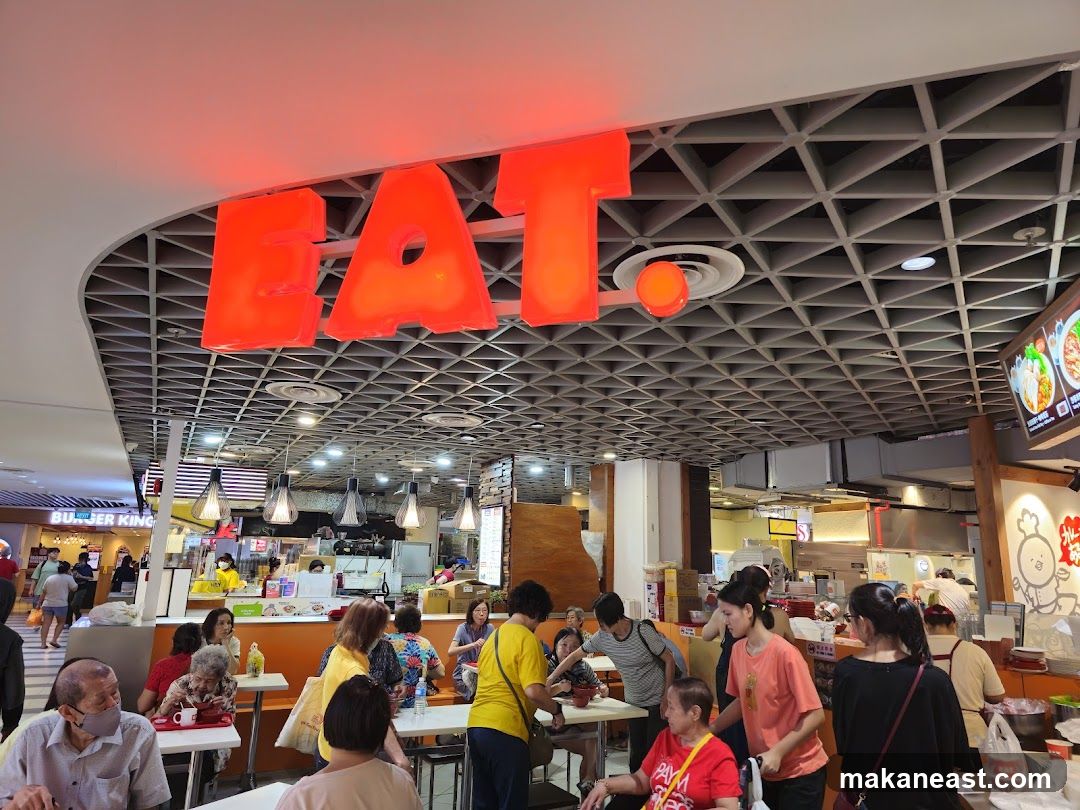 Food court with large red "EAT" sign