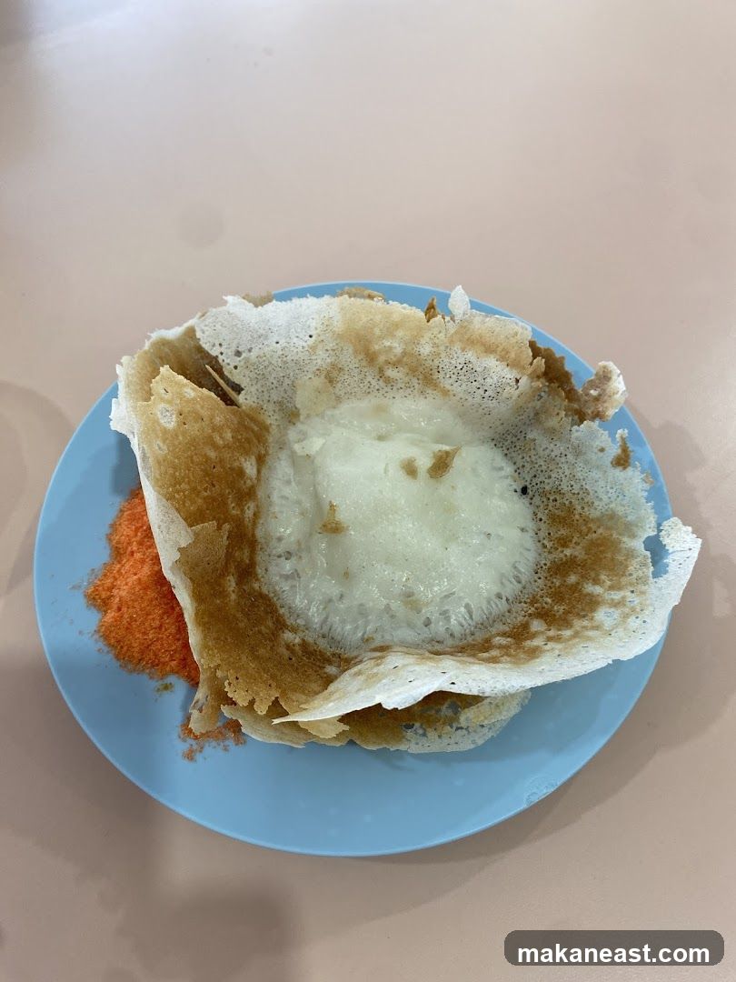 Appam with Coconut Flakes
