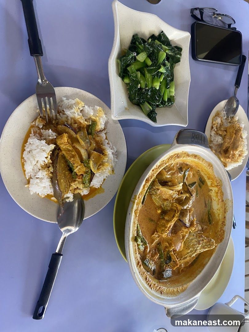 Curry dishes with rice and vegetables