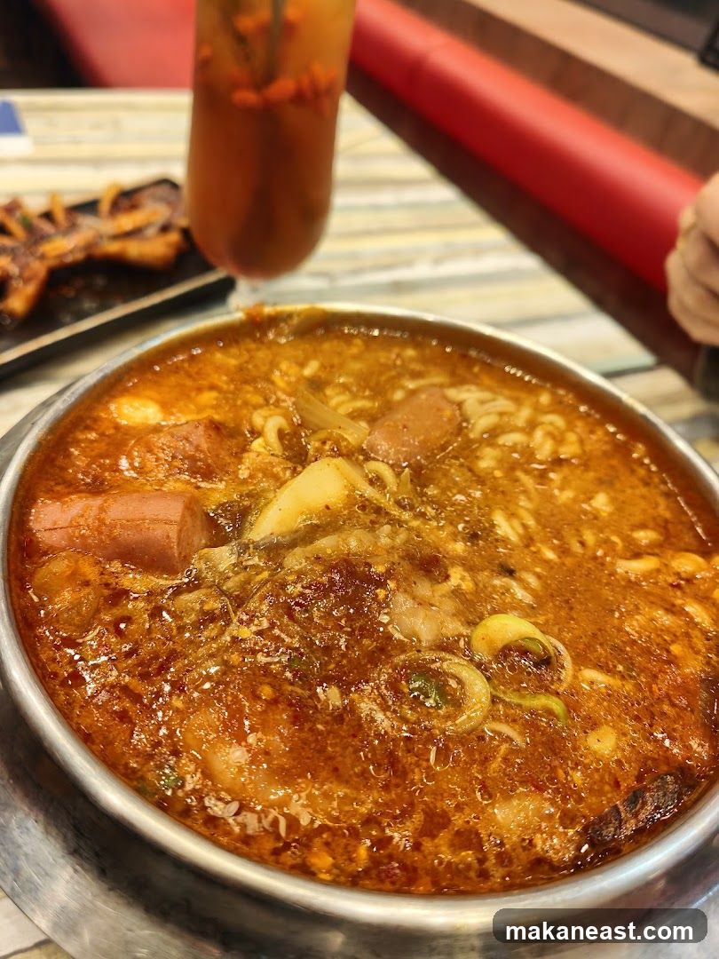 Spicy Noodle Soup with Hot Dogs and Seafood