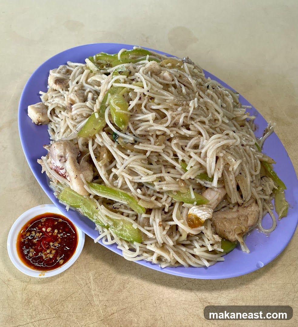 Stir-fried noodles with chicken and bitter gourd