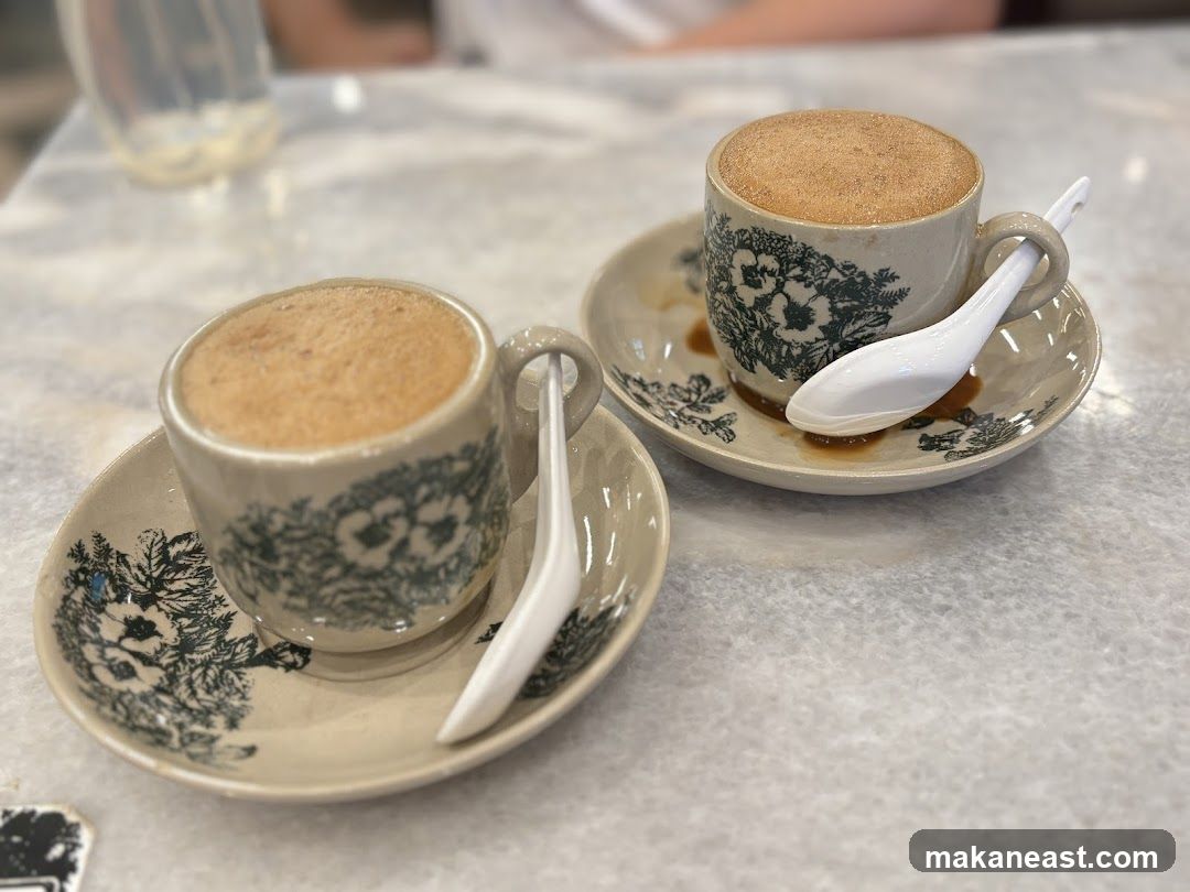 Two cups of coffee with foam