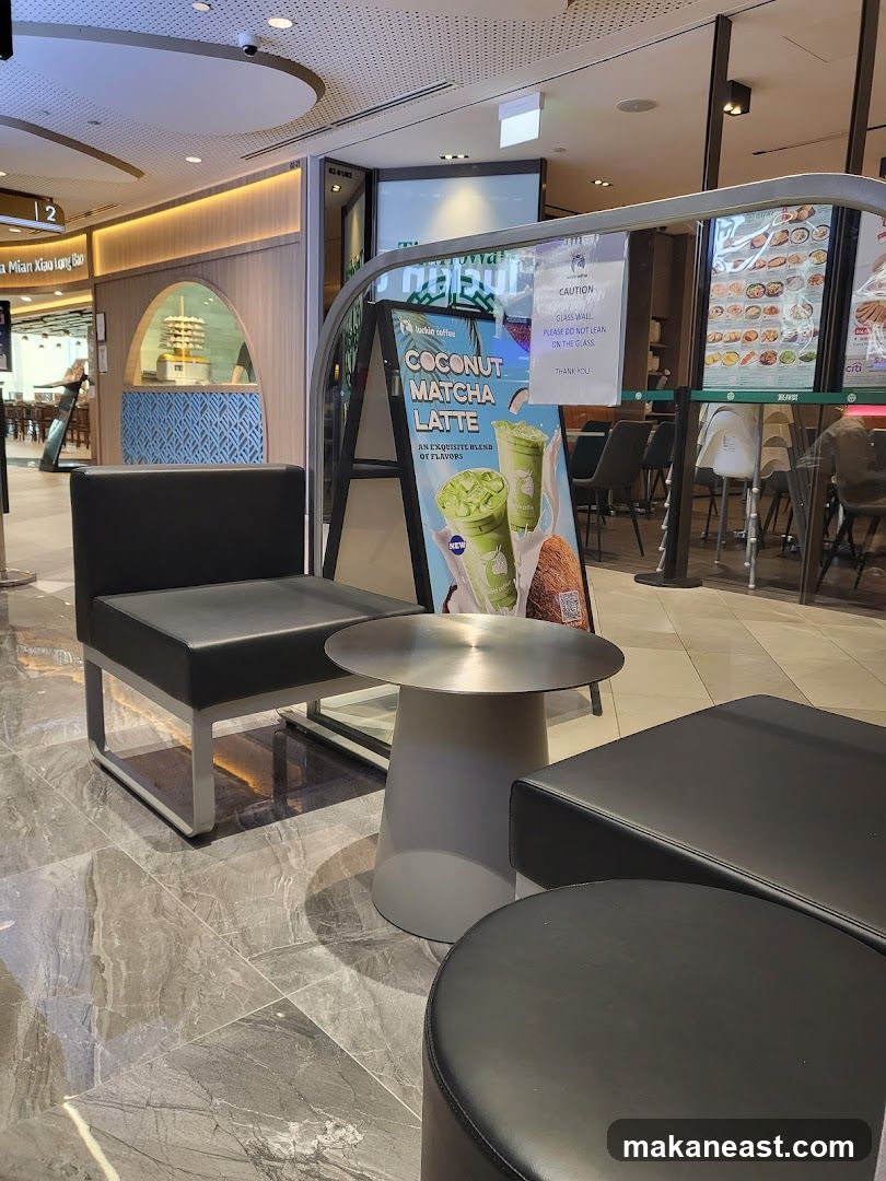 Coffee shop seating area with promotional sign